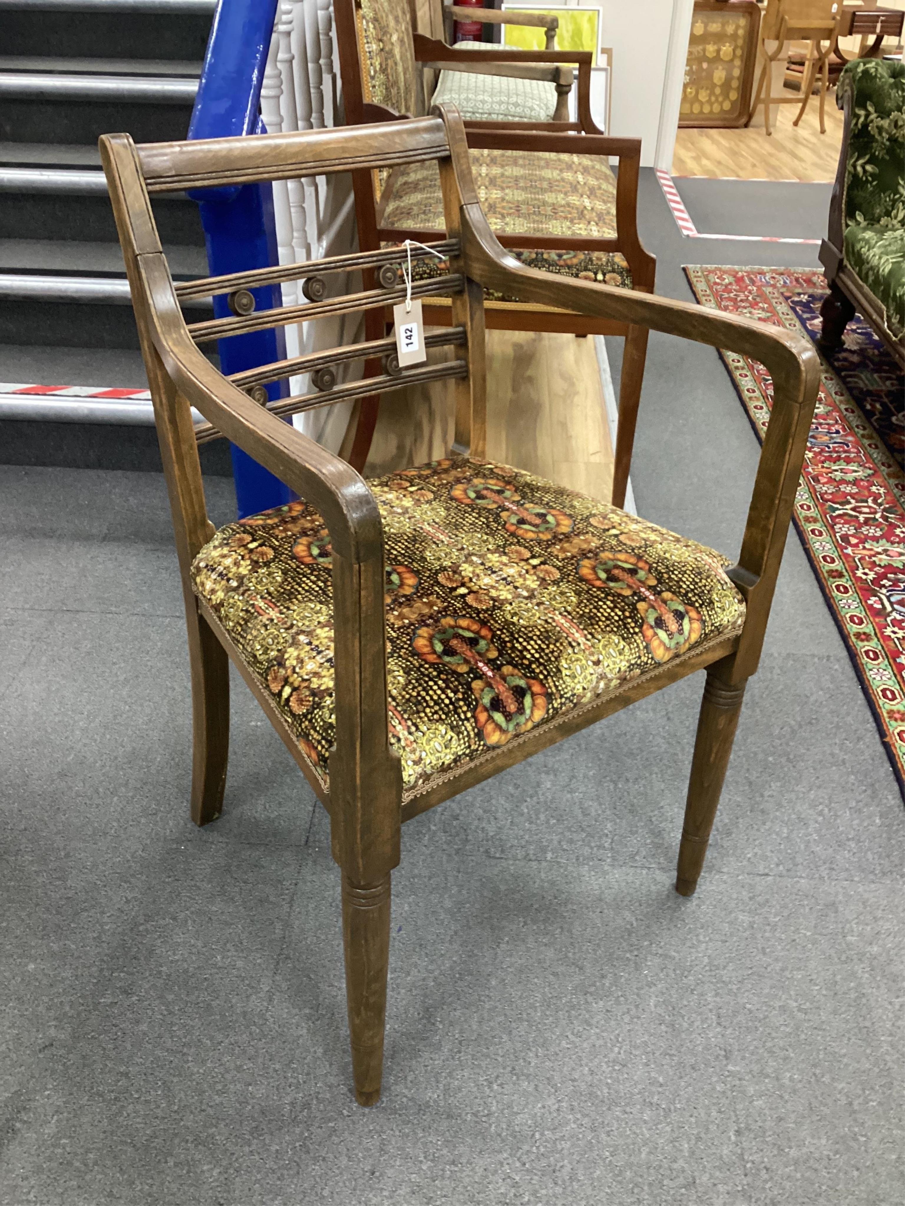 A set of eight Regency style beech elbow chairs recently re-upholstered in Julie Kuyath fabric. Condition - good